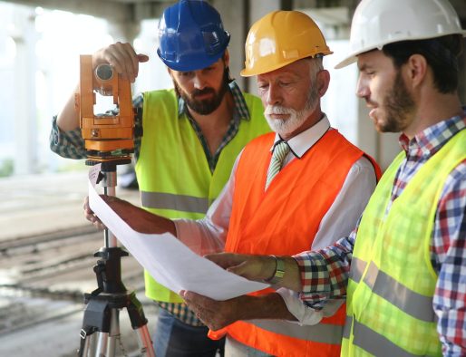 Architect and construction engineer or surveyor discussion plans and blueprints