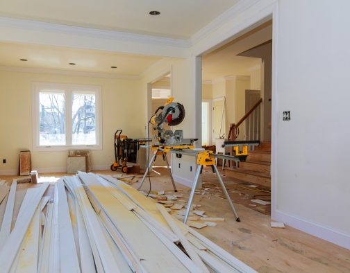 Circular saw cutting wooden trim on with on remodeling home