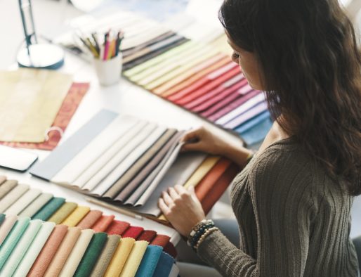 Young interior designer choosing fabric samples